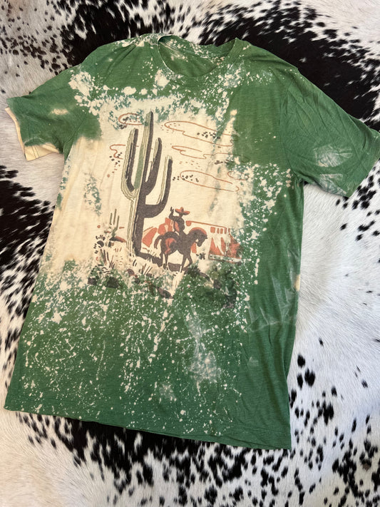 Medium western tee with one small spot as pictured